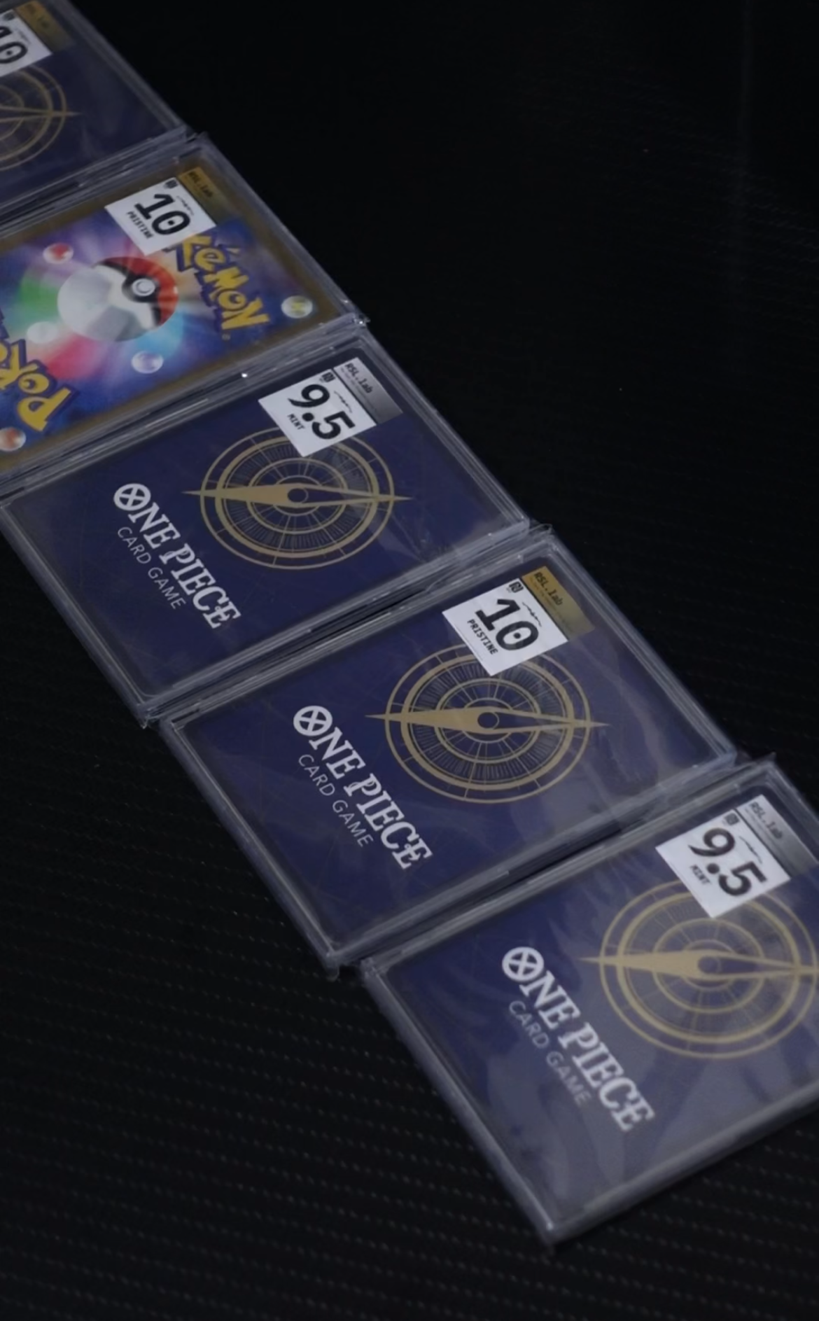 Row of RSL.lab graded slabs — Pokémon and One Piece cards scored 9.5 MINT and 10 PRISTINE